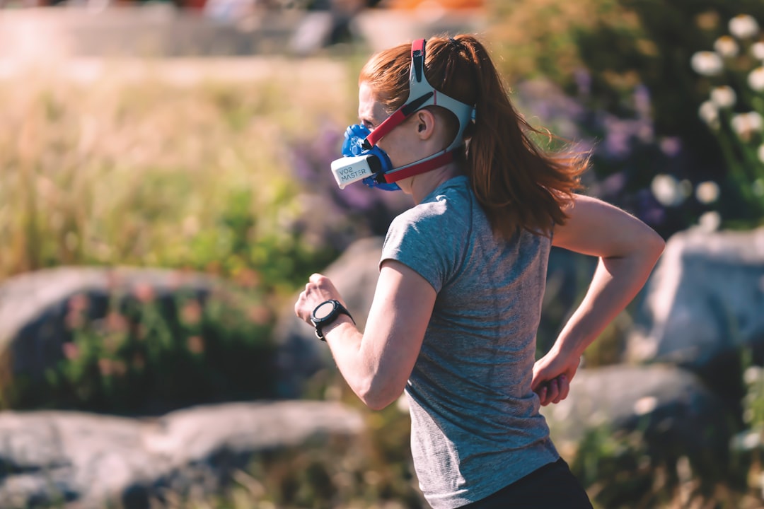 Athlete wearing altitude training mask for respiratory exercise