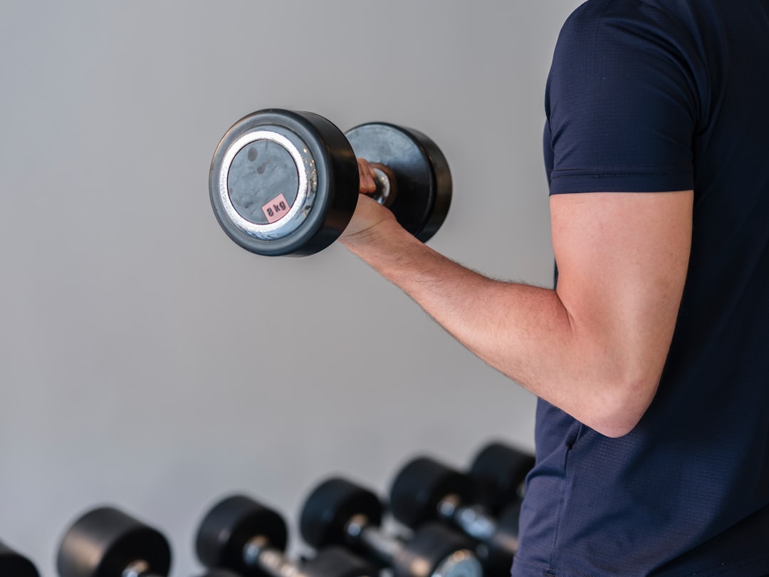 Loaded carries farmer walk training with dumbbells for grip and core strength