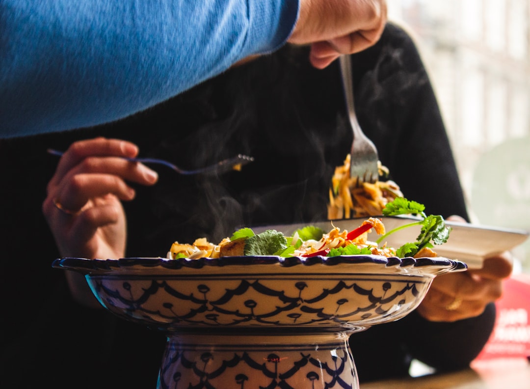 Person eating mindfully with attention to food