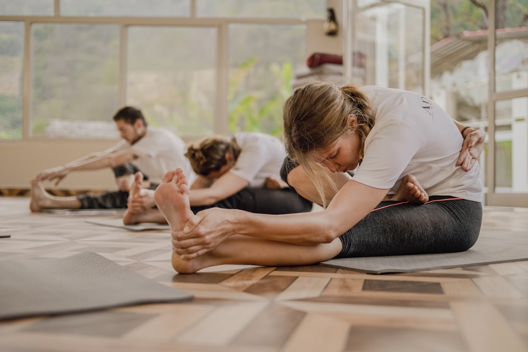 Person practicing mobility and flexibility training in gym