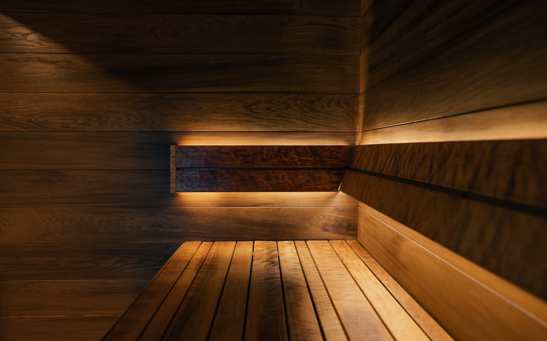 Wooden sauna room with warm lighting for training recovery
