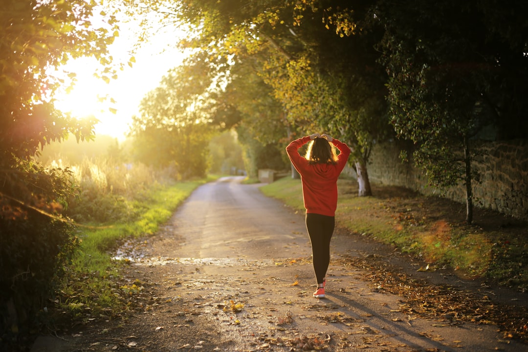 Person walking outdoors in nature practicing mindfulness